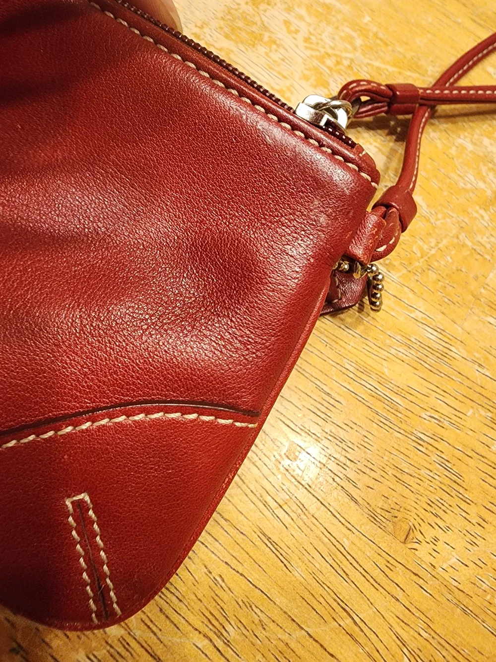 vintage Coach red leather Soho mini wristlet pouch featuring white contrast